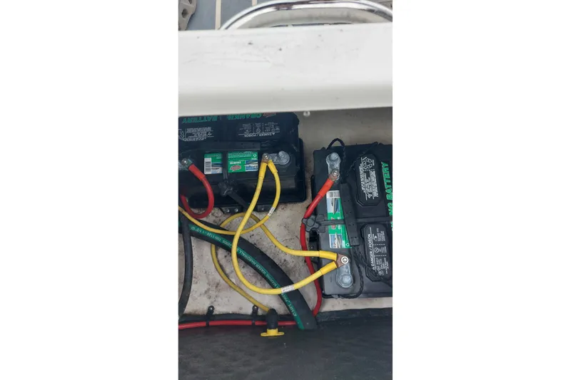 Slide: The Image of Batteries and wiring inside a 2018 Chaparral 230 Suncoast boat. - 11