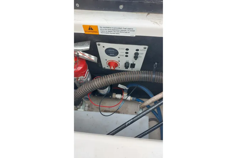 Slide: The Image of Control panel and wiring inside a 2018 Chaparral 230 Suncoast boat. - 16