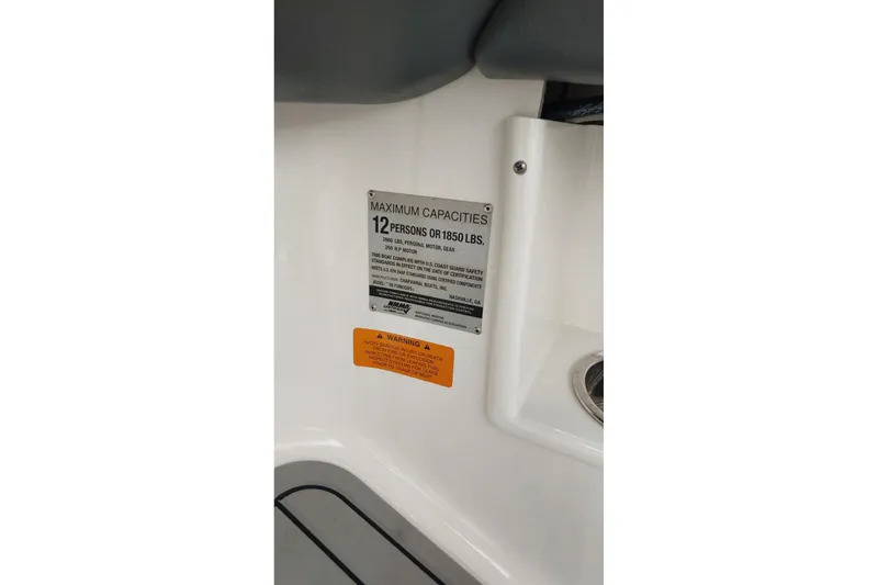 Slide: The Image of 2018 Chaparral 230 Suncoast capacity plate, maximum 12 persons or 1850 lbs. - 17