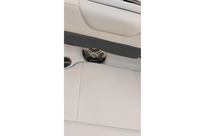 Slide: The Image of Interior of 2018 Chaparral 230 Suncoast boat, featuring speaker and cup holder. - 8