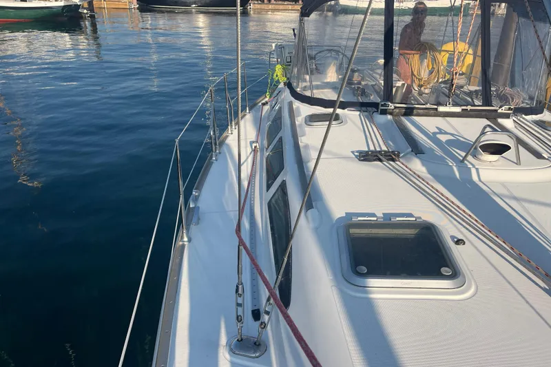 Slide: The Image of 2005 Jeanneau Sun Odyssey 40.3 sailboat docked, showcasing deck and rigging details. - 10