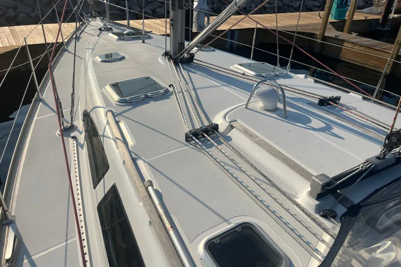 Slide: The Image of Deck view of 2005 Jeanneau Sun Odyssey 40.3 sailboat, showcasing rigging and hatches. - 11