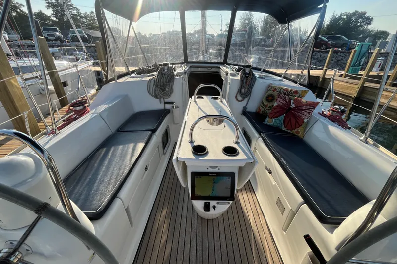 Slide: The Image of Cockpit of 2005 Jeanneau Sun Odyssey 40.3 sailboat with seating and navigation equipment. - 14