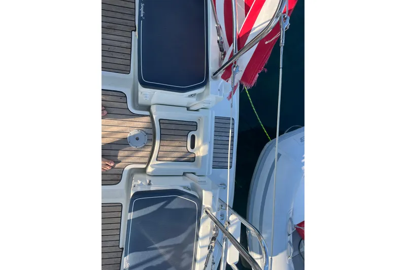 Slide: The Image of Deck view of 2005 Jeanneau Sun Odyssey 40.3 sailboat with red sail. - 15