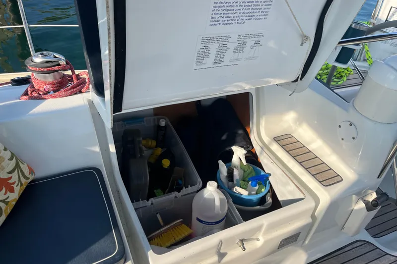 Slide: The Image of Storage compartment on a 2005 Jeanneau Sun Odyssey 40.3 sailboat, containing cleaning supplies. - 19