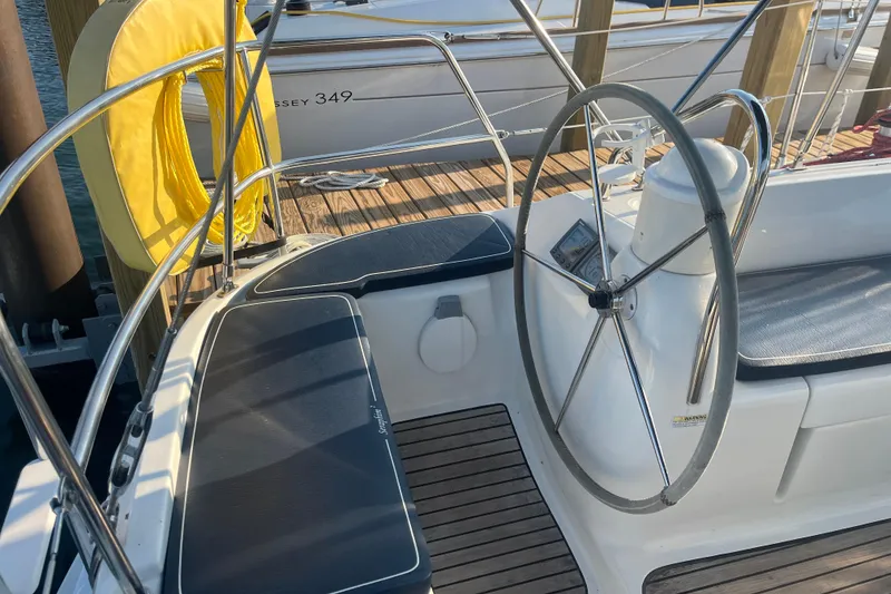 Slide: The Image of Cockpit of 2005 Jeanneau Sun Odyssey 40.3 sailboat with steering wheel and seating. - 21