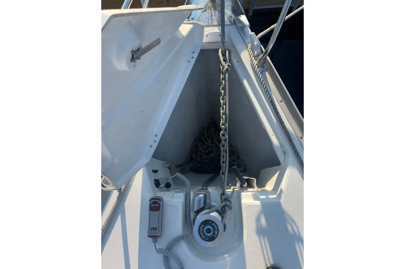 Slide: The Image of Anchor locker of 2005 Jeanneau Sun Odyssey 40.3 sailboat with chain and windlass. - 22