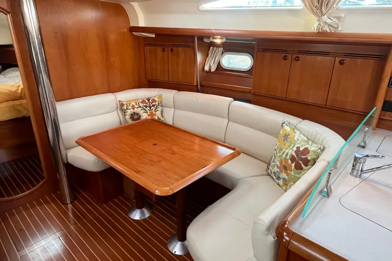 Slide: The Image of Luxurious interior of 2005 Jeanneau Sun Odyssey 40.3 sailboat with elegant wood finish. - 24