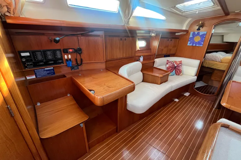 Slide: The Image of Interior of 2005 Jeanneau Sun Odyssey 40.3 yacht with wooden finish and cozy seating. - 27