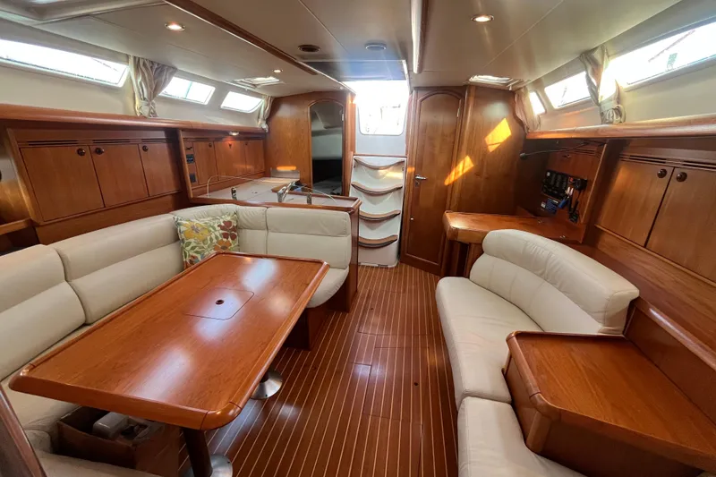 Slide: The Image of Luxurious interior of 2005 Jeanneau Sun Odyssey 40.3 yacht with elegant wood finish. - 28
