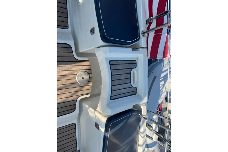 Slide: The Image of Deck view of 2005 Jeanneau Sun Odyssey 40.3 sailboat with wooden and cushioned seating. - 31