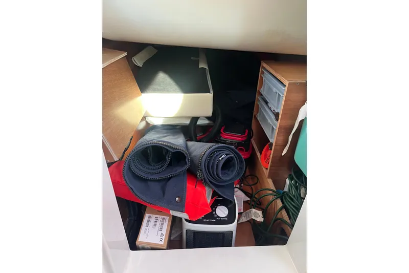 Slide: The Image of Storage compartment of 2005 Jeanneau Sun Odyssey 40.3 yacht with various equipment. - 35