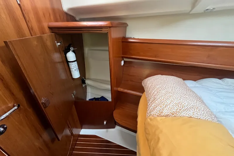Slide: The Image of Cozy cabin interior of 2005 Jeanneau Sun Odyssey 40.3 with wooden finish and storage. - 37
