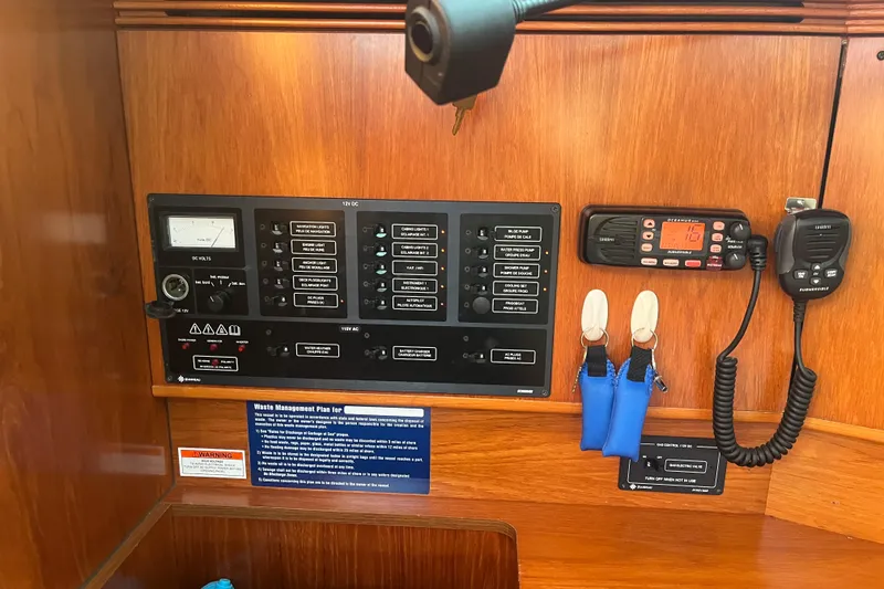 Slide: The Image of Control panel of a 2005 Jeanneau Sun Odyssey 40.3 sailboat with communication equipment. - 48