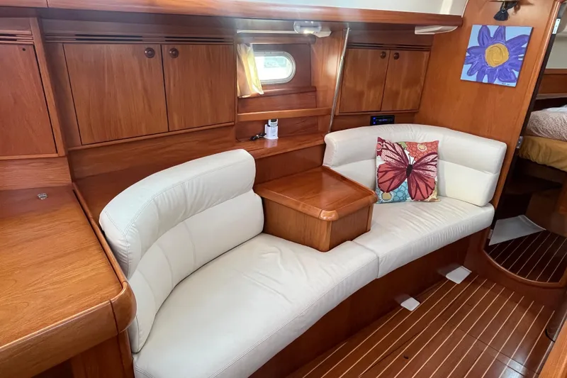 Slide: The Image of Interior of 2005 Jeanneau Sun Odyssey 40.3 yacht with elegant wood finish and cozy seating. - 49