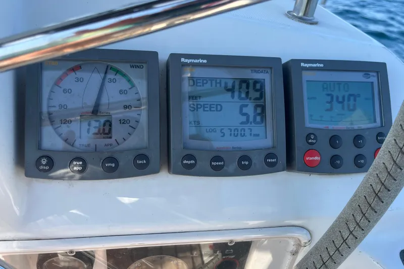 Slide: The Image of Instrument panel on a 2005 Jeanneau Sun Odyssey 40.3 sailboat displaying navigation data. - 51