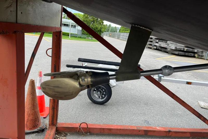 Slide: The Image of Propeller and rudder of 2005 Jeanneau Sun Odyssey 40.3 sailboat on a stand. - 54