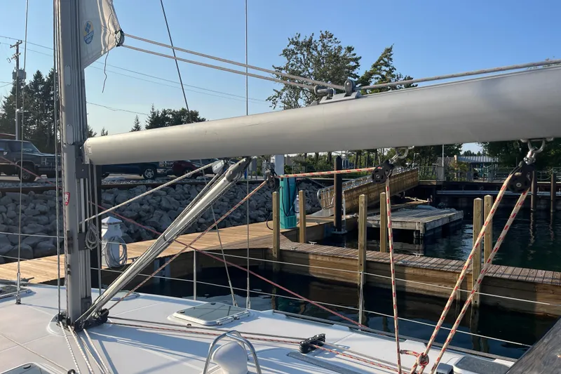 Slide: The Image of Jeanneau Sun Odyssey 40.3 sailboat docked, showcasing mast and rigging, 2005 model. - 7