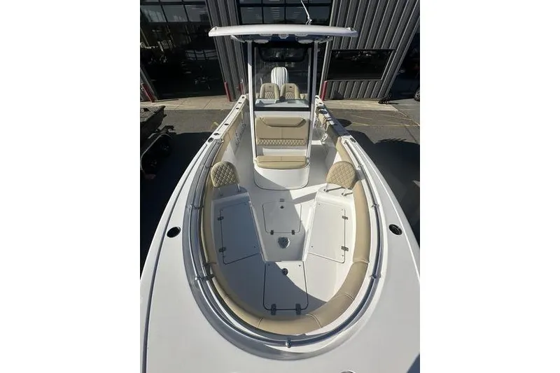 Slide: The Image of 2026 Sportsman Heritage 231 Center Console boat with spacious seating and modern design. - 14