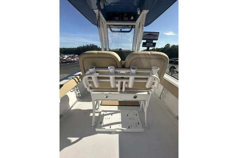 Slide: The Image of 2026 Sportsman Heritage 231 Center Console boat interior with seating and rod holders. - 15