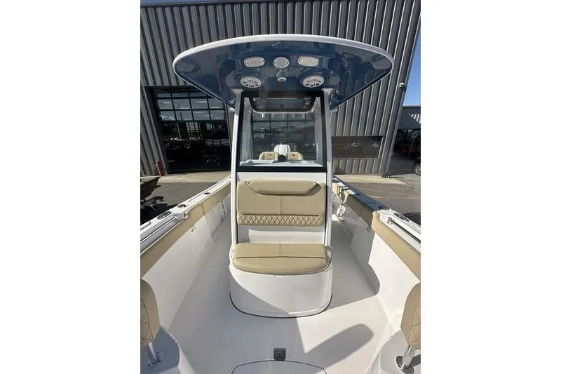 Slide: The Image of 2026 Sportsman Heritage 231 Center Console boat interior with seating and overhead console. - 18