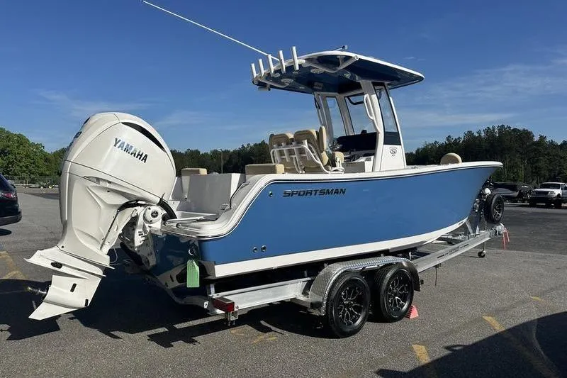 Slide: The Image of 2026 Sportsman Heritage 231 Center Console boat on trailer, featuring Yamaha outboard motor. - 4
