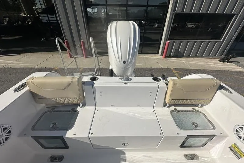 Slide: The Image of 2026 Sportsman Heritage 231 Center Console boat interior with seating and storage compartments. - 5