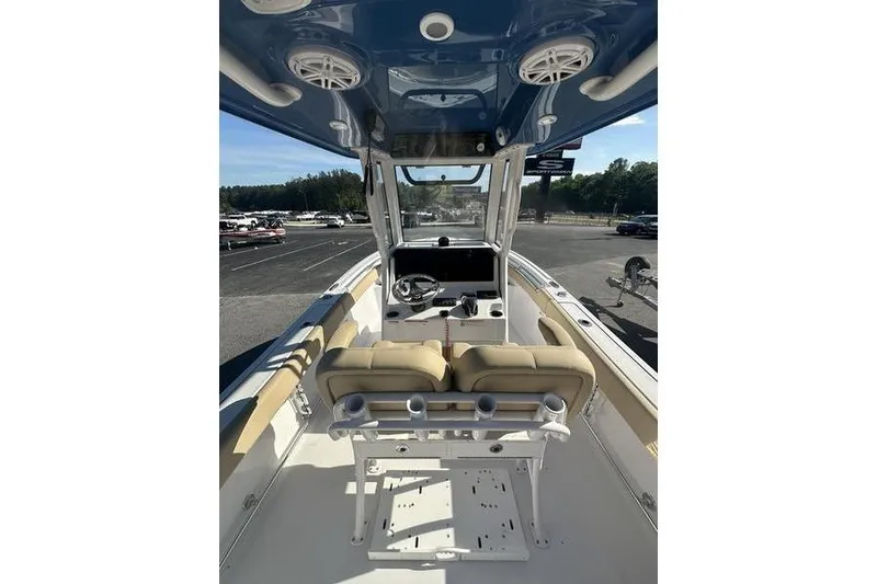 Slide: The Image of 2026 Sportsman Heritage 231 Center Console boat interior with helm and seating. - 8