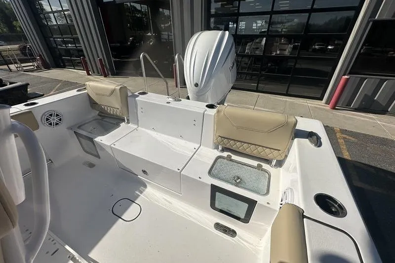 Slide: The Image of 2026 Sportsman Heritage 231 Center Console boat interior with seating and storage compartments. - 9