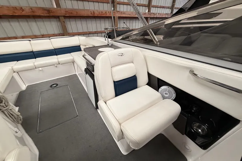 Slide: The Image of 2008 Regal 2700 Bowrider interior with white seating and modern dashboard. - 24