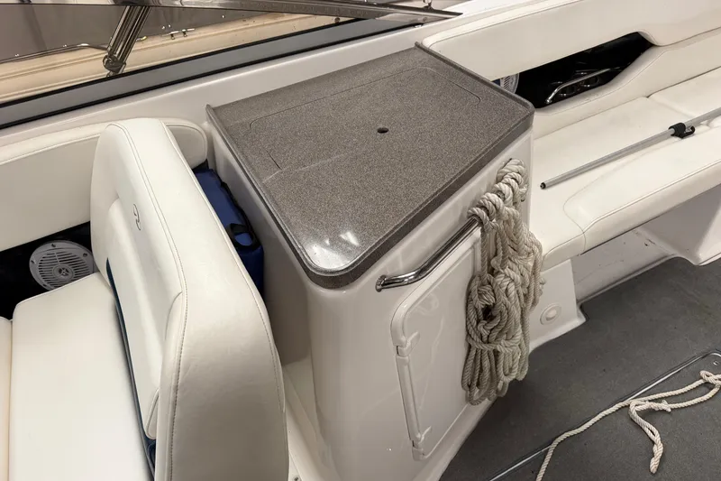 Slide: The Image of 2008 Regal 2700 Bowrider interior with seating, storage, and coiled rope. - 29