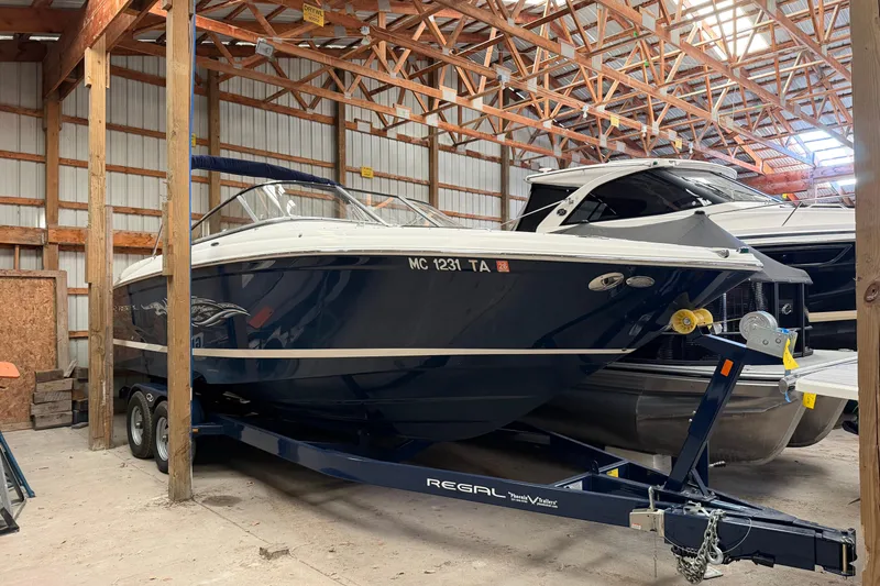 The Image of 2008 Regal 2700 Bowrider boat on trailer in storage facility. - 3