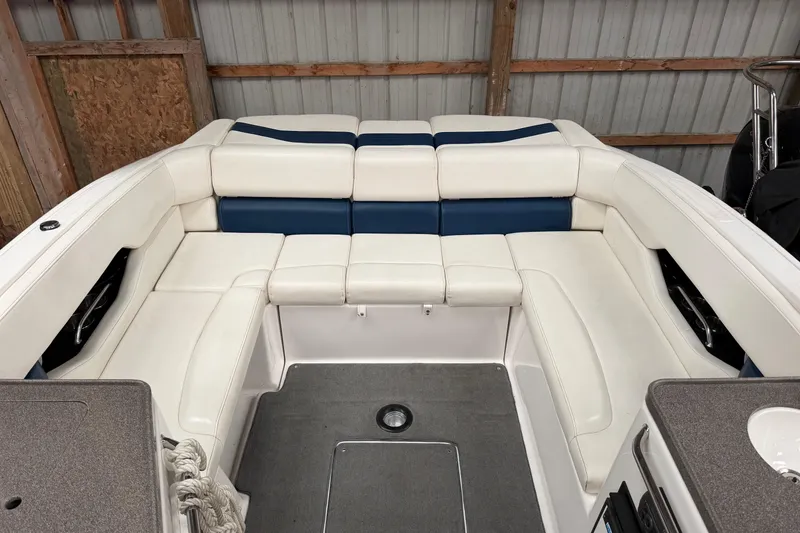 Slide: The Image of 2008 Regal 2700 Bowrider interior with white and blue seating in a storage area. - 30