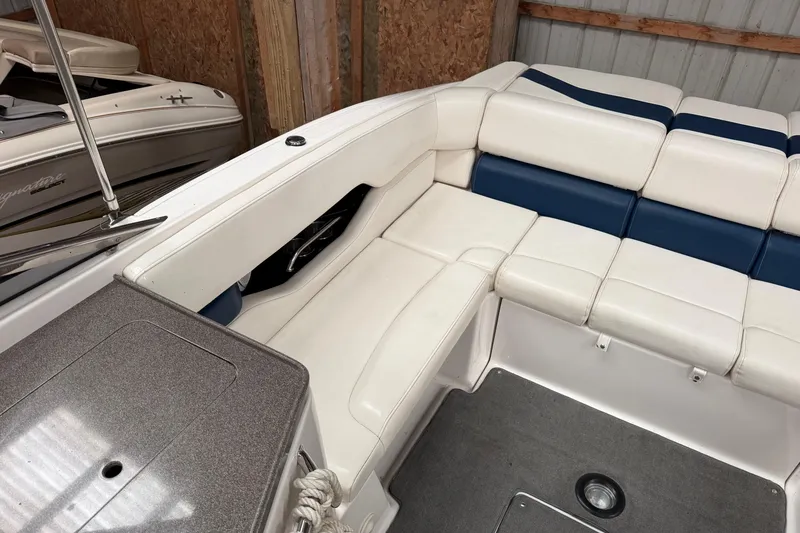 Slide: The Image of 2008 Regal 2700 Bowrider interior with white and blue seating, showcasing spacious design. - 31