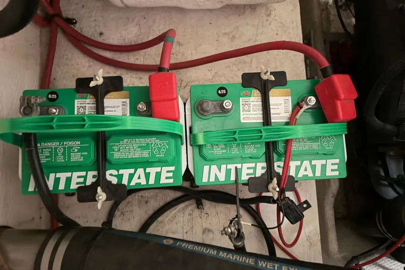 Slide: The Image of Interstate marine batteries in a 2008 Regal 2700 Bowrider boat engine compartment. - 41