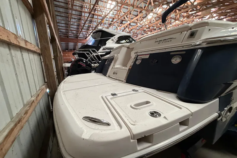 Slide: The Image of 2008 Regal 2700 Bowrider boat stored in a wooden shed. - 6