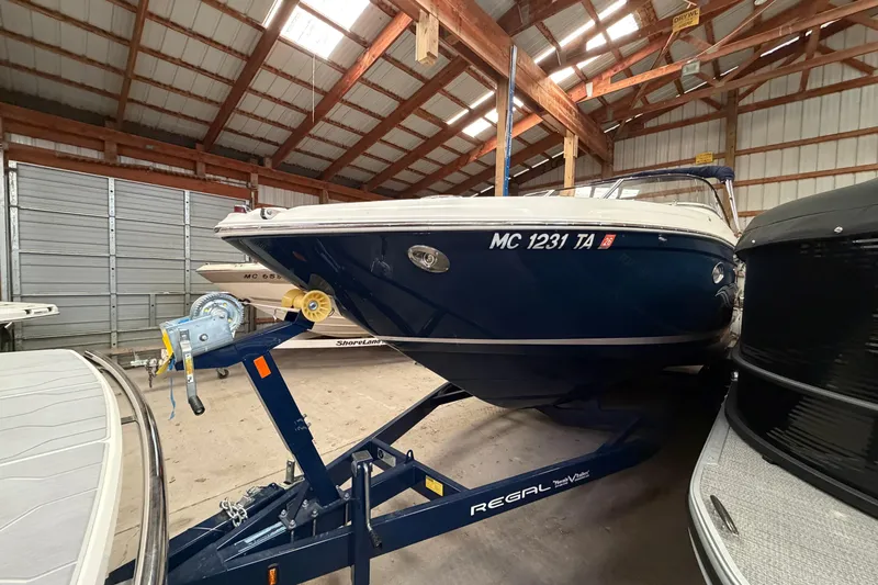 Slide: The Image of 2008 Regal 2700 Bowrider boat on trailer in storage facility. - 7