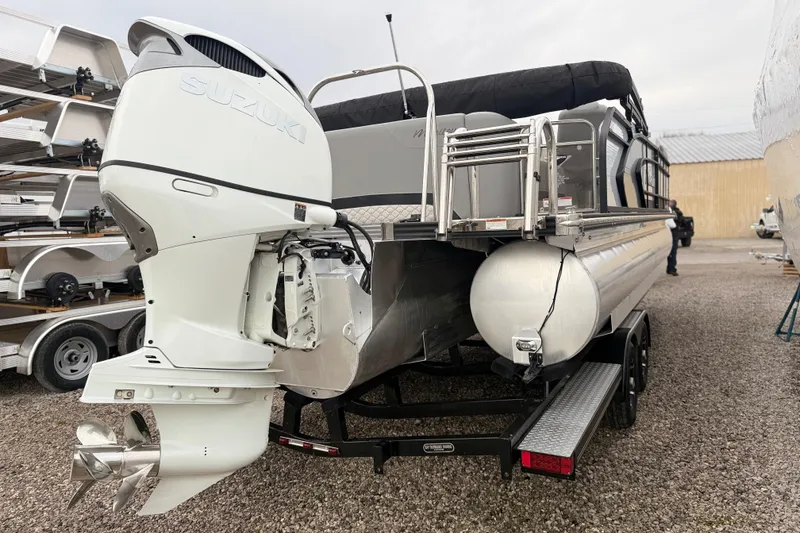 Slide: The Image of 2022 Manitou 230 Encore SL SHP pontoon boat with Suzuki outboard motor. - 12