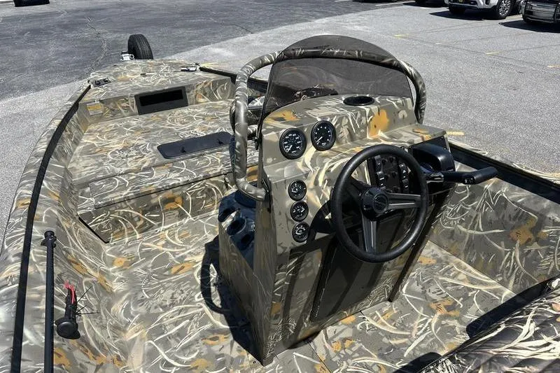 Slide: The Image of Camouflage interior of 2026 War Eagle 2170 Blackhawk boat with steering console. - 5