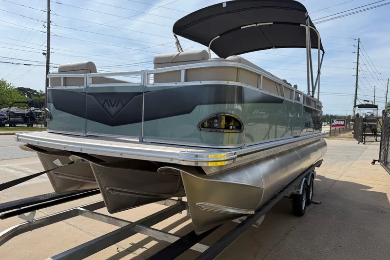 Slide: The Image of 2026 Avalon VENTURE QUAD LOUNGE pontoon boat on trailer, featuring sleek design and canopy. - 58