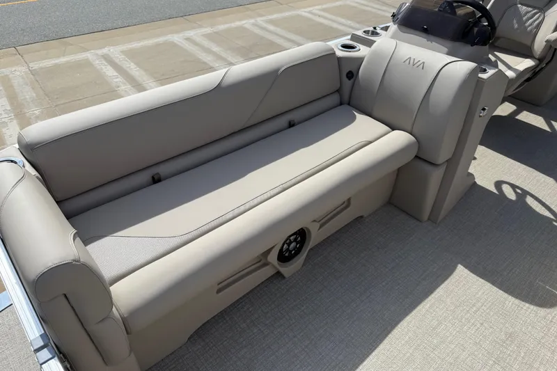 Slide: The Image of 2026 Avalon VENTURE QUAD LOUNGE boat interior with beige seating and steering console. - 65