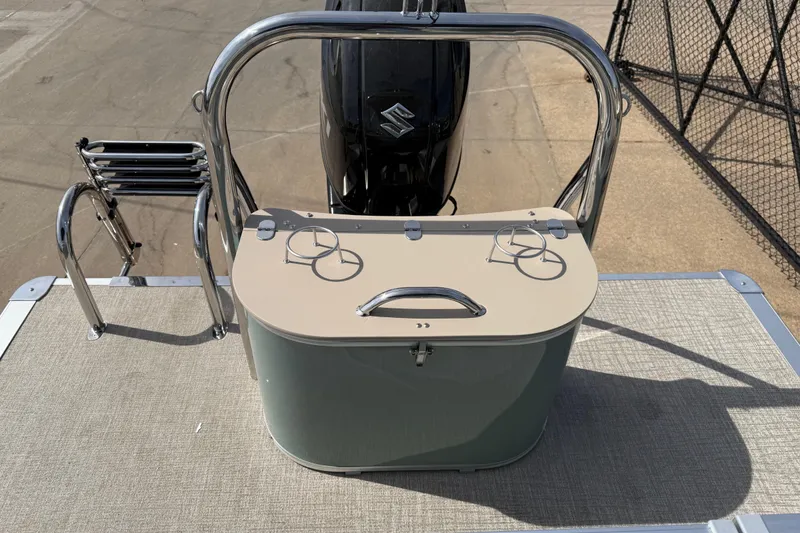 Slide: The Image of 2026 Avalon VENTURE QUAD LOUNGE boat deck with stainless steel railing and motor. - 72