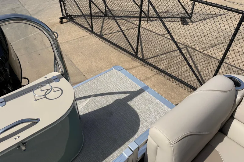 Slide: The Image of 2026 Avalon VENTURE QUAD LOUNGE boat interior with beige seating and sleek design. - 74