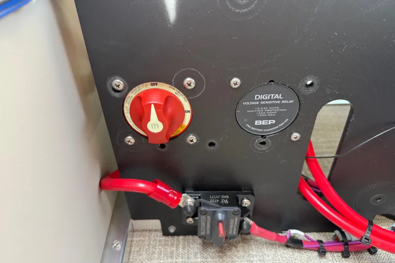Slide: The Image of Electrical panel with red switch and digital voltage relay in 2026 Avalon VENTURE QUAD LOUNGE. - 78