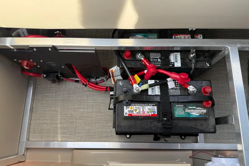 Slide: The Image of Battery compartment of 2026 Avalon VENTURE QUAD LOUNGE with wiring and connections visible. - 79