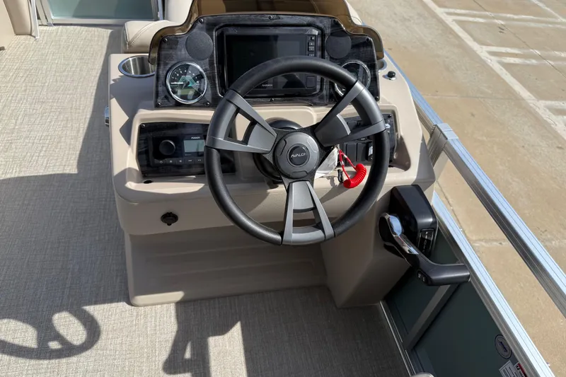 Slide: The Image of Steering console of 2026 Avalon VENTURE QUAD LOUNGE boat with modern controls and dashboard. - 81