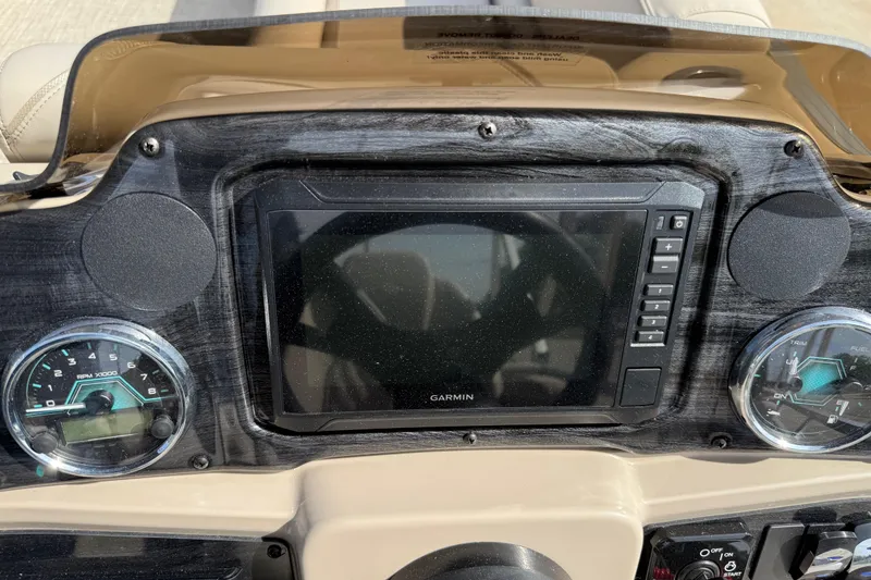 Slide: The Image of Dashboard of 2026 Avalon VENTURE QUAD LOUNGE with Garmin display and gauges. - 82