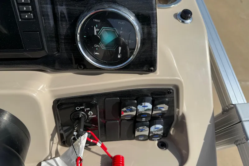 Slide: The Image of Control panel of 2026 Avalon VENTURE QUAD LOUNGE boat with ignition and switches. - 85
