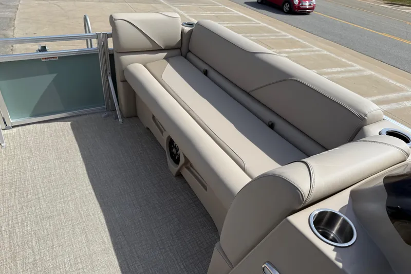 Slide: The Image of 2026 Avalon VENTURE QUAD LOUNGE interior with beige seating and cup holders. - 87