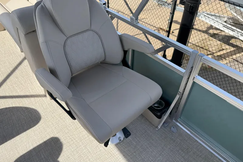 Slide: The Image of Luxurious seating on 2026 Avalon VENTURE QUAD LOUNGE boat, featuring plush upholstery and armrests. - 88